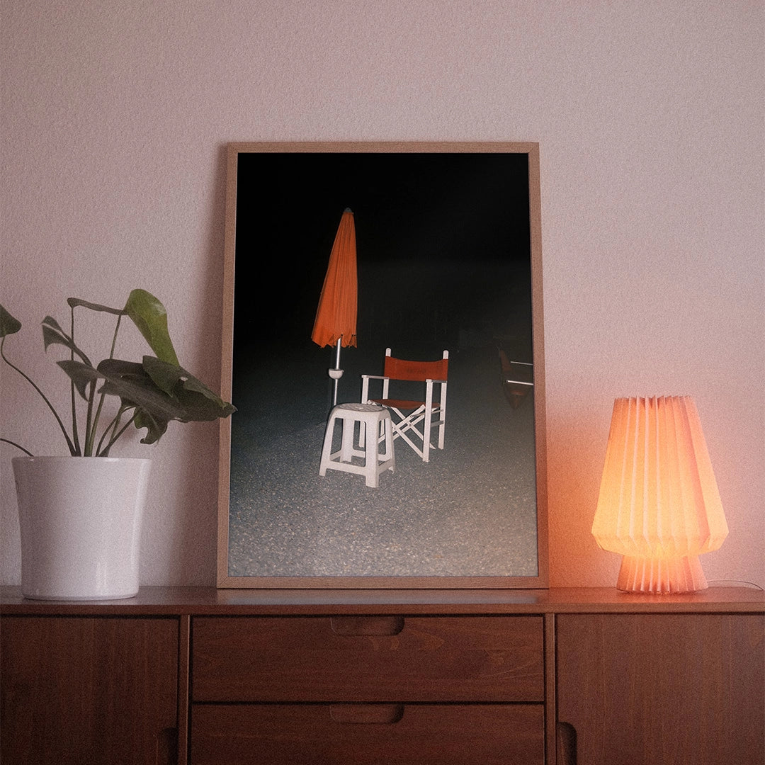 A poster with the photographic motif “Bagnino” by POWSTR hanging in a living room.