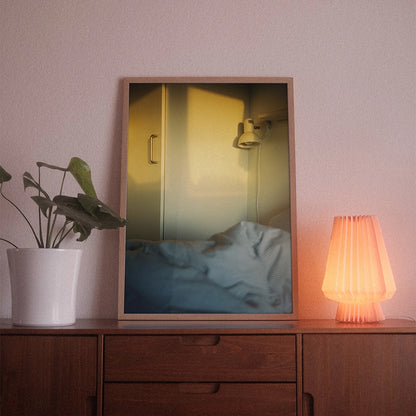 A poster with the photographic motif “Danish Morning” by POWSTR hanging in a living room.