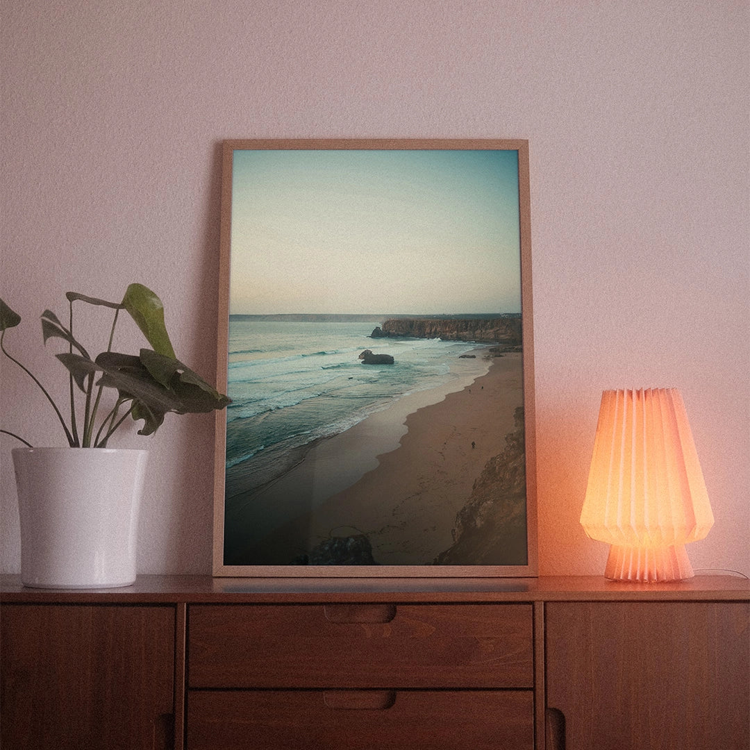 A poster with the photographic motif “Tonel” by POWSTR hanging in a living room.