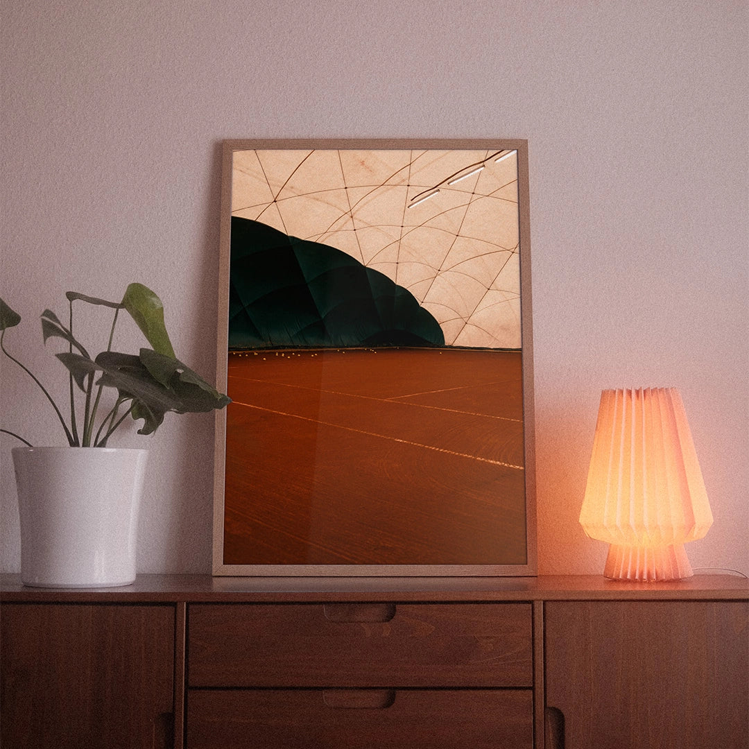 A poster with the photographic motif “Training Court” by POWSTR hanging in a living room.