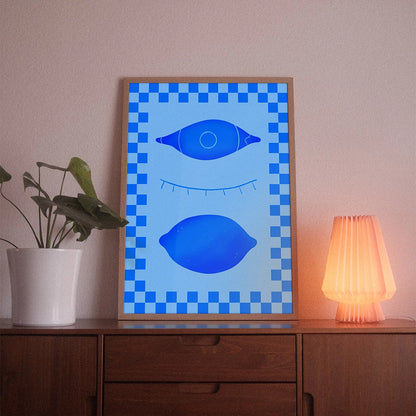 A poster with the illustrative motif “Eyes Closed” by POWSTR hanging in a living room.
