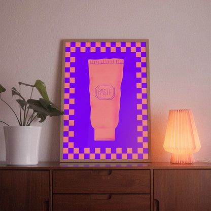 A poster with the illustrative motif “Paste” by POWSTR hanging in a living room.